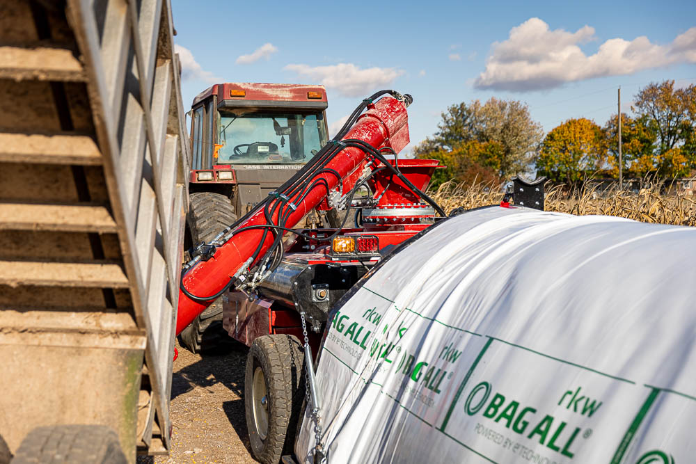 Filling the bag with freshly processed corn. The hoop comes in a 6', 8', or 10' size. 