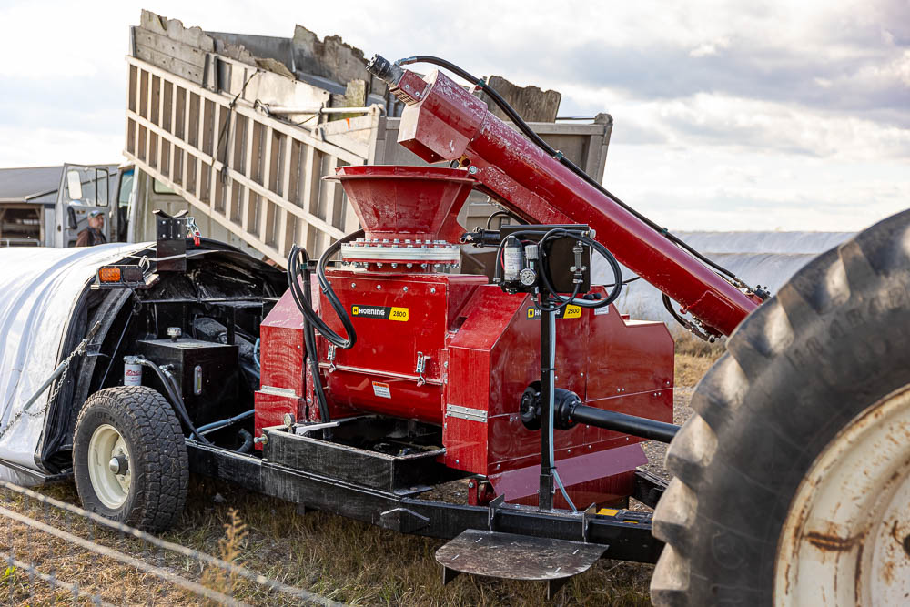 A close-up shot of the right side of the shredder mill. Notice the acid inoculation kit mounted on the post near the front of the mill. 